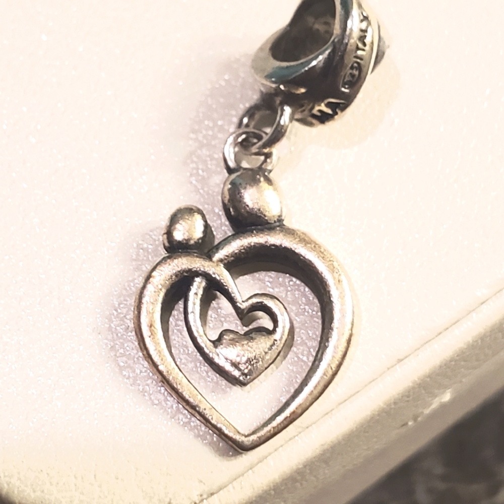 Sterling Silver MA Dangling two persons sharing Heart Charm. Good Condit…